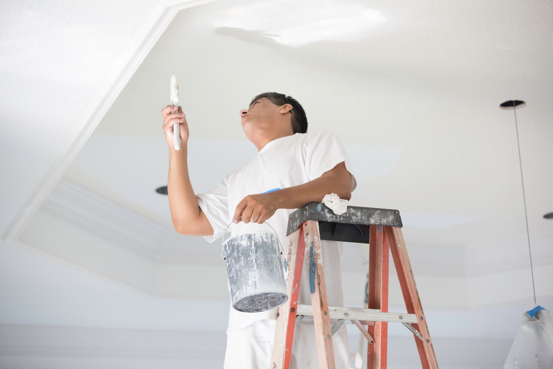 Painter painting a ceiling.